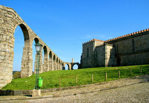 Historic stone aqueduct and castle ruins in Perafita, Portugal at EcoHost