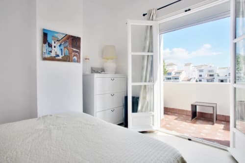 Bright bedroom with sea view terrace at Marbella Home Rentals Puerto Banús apartment