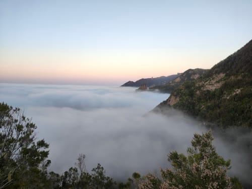 Misty coastal landscape at dawn showing Anaga mountains and sea, Tenerife terrace view
