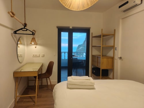 Romantic sea view apartment bedroom at Nido Anaga, Santa Cruz de Tenerife, with modern furnishings and balcony overlooking