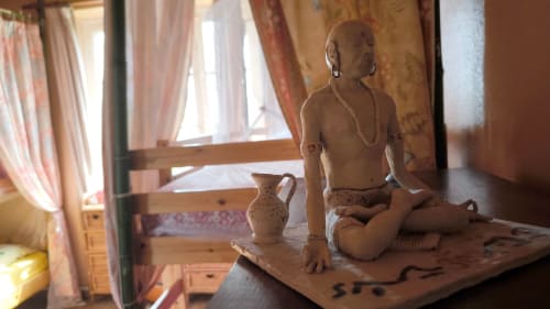 Terracotta sculpture in tribal room at Le Lama Zébré, Penmarch