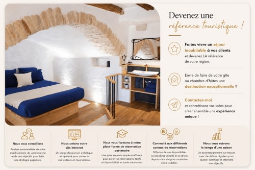 Maison Lapopie bedroom with blue bed, stone arch, and wooden desk in Saint-Cirq-Lapopie