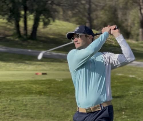 Golfer mid-swing at Cagnes-sur-Mer course, STAYnGOLF bed and breakfast