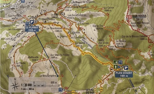 Topographic map of French Alps near Flumet showing trails, elevations, and parking at Le Planay and Plan Desert