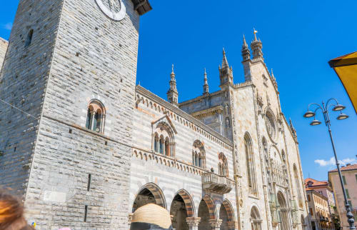 Historic white stone cathedral with Gothic spires in Como, Italy near Alessia's Place B&B