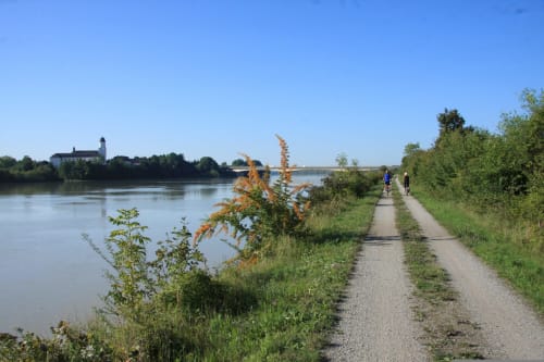 Rural cycling path along Rhone River near Le Prieuré Notre-Dame in Montfrin, France