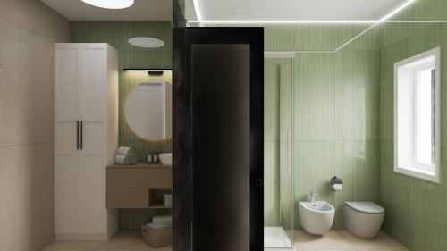 Modern bathroom at Stella CasaBono hotel in Sulmona with green tile walls, dual sinks, and bidet fixtures