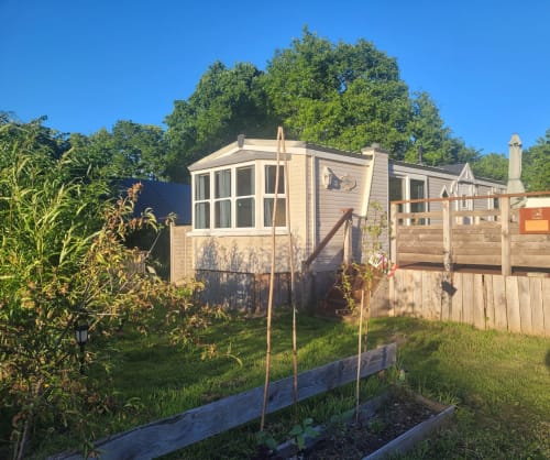 Deer Country Cabin at Postwood Gardens Campsite in Kentisbeare with garden view and wooden raised beds