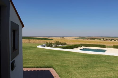 Modern white villa with pool overlooking rolling countryside at Monte da Morena rural guesthouse in Serpa, Portugal