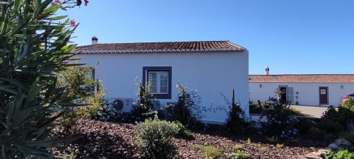 Monte da Morena countryside guesthouse in Serpa, Portugal with white-washed walls and terracotta roof among gardens