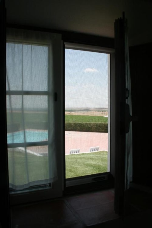 View from Superior Double Room at Monte Da Morena showing garden, pool, and Alentejo countryside near Serpa, Portugal