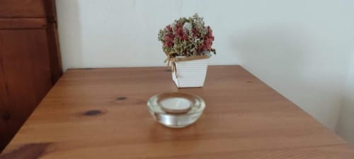 Wooden table in Superior Double Room at Monte Da Morena, Serpa with dried flower arrangement and glass ashtray