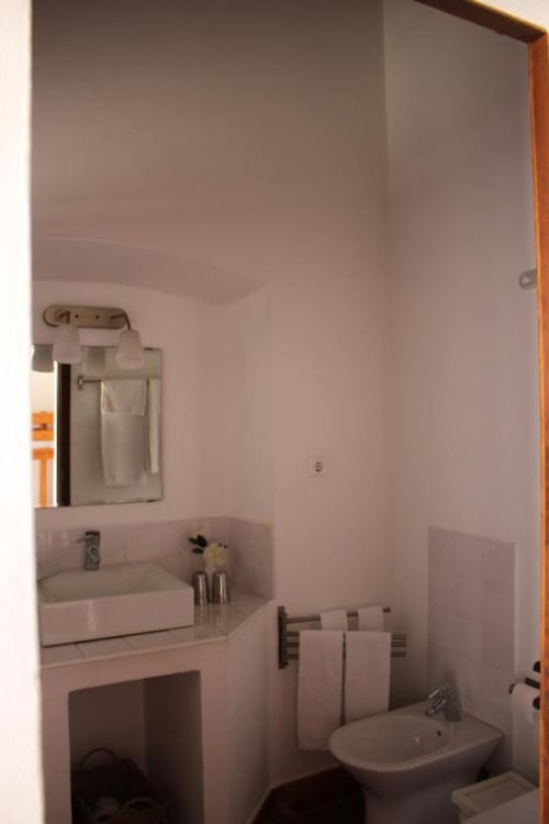 Modern bathroom in Superior Double Room at Monte Da Morena, Serpa featuring sink, bidet, and toilet with towel rack
