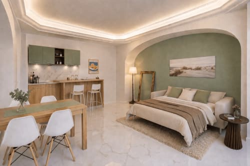 Modern studio apartment at Colosseum Exclusive Stay Rome with sage green accent wall, bed, dining table, and kitchen area