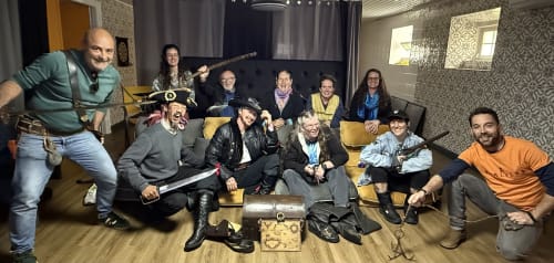 Group enjoying pirate-themed escape room activity at Golden Mermaid Villa guesthouse in Ribeirinha, Portugal