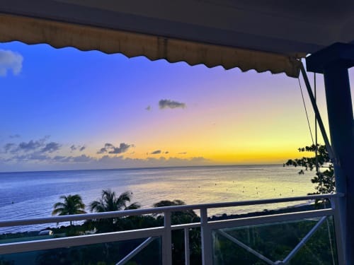 Sunset view from Horizon Doré balcony overlooking Caribbean sea in Gourbeyre, Guadeloupe