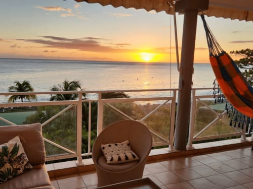 Sunset ocean view from Horizon Doré terrace in Gourbeyre with hammock and comfortable seating