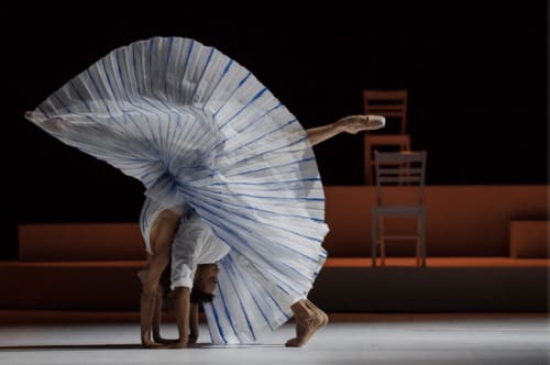 Graceful dancer performing backbend with blue-white fabric at Lou Paradou Lodge, Grillon