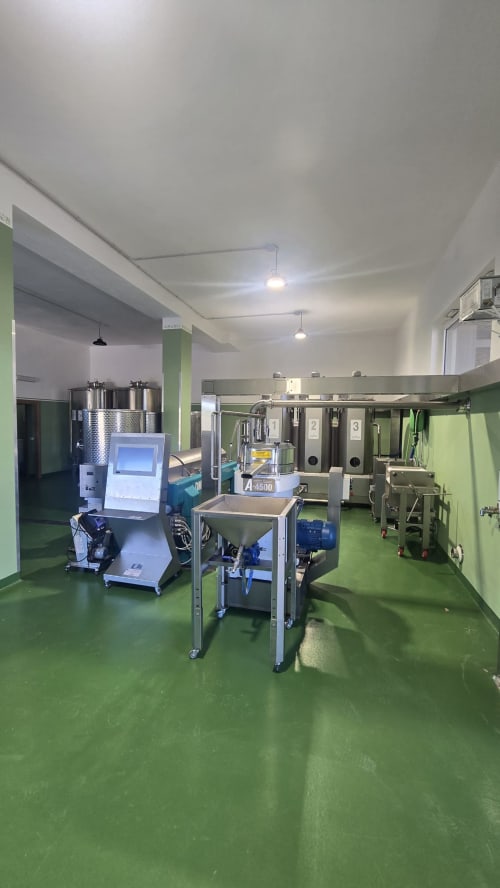 Modern food production facility at Fogliantica agrituristica with processing equipment and green epoxy flooring