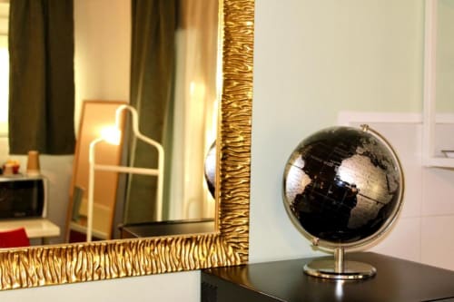 Decorative black and gold globe on desk in Green Gate Airport Guest House single room, Pisa