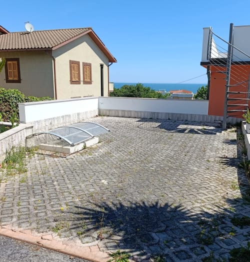 Coastal apartment patio with sea view, paved garden terrace near Ancona, Italy