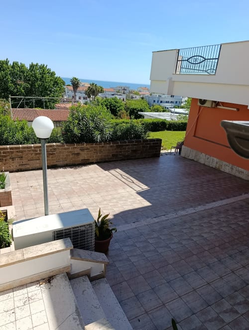 Casa Bertila apartment terrace with sea view in Ancona, featuring garden patio and modern amenities
