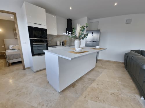 Modern open-plan kitchen and living area at Smooth Luberon Apt Belvedere in Villars with island counter and mountain views