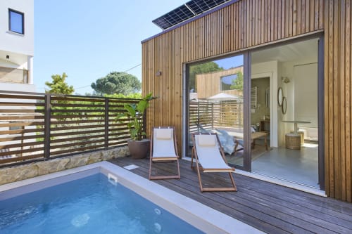 Aroeira pool apartment at Casa Redonda with sun loungers, private pool, wooden deck, and modern open-plan interior