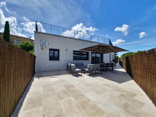 Smooth Luberon Apt Belvedere terrace with patio seating, white modern building, mountain views, Villars