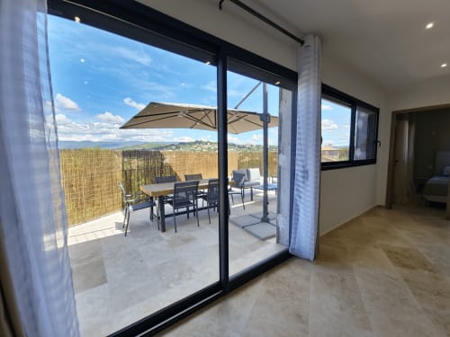 Smooth Luberon apartment balcony in Villars with dining area, mountain views, and countryside landscape
