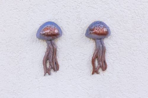 Two decorative jellyfish wall art pieces in the Medusa room at Senia del Rais, Favignana