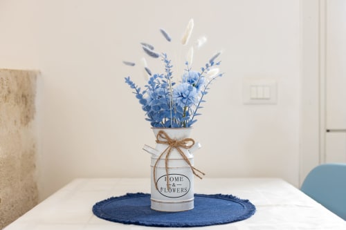 Blue dried flowers in a 'Home & Flowers' vase at Senia del Rais, Favignana apartment rental