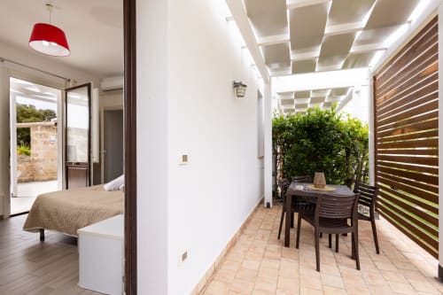 Tartaruga Marina apartment at Senia del Rais in Favignana with ocean-view terrace, dining area, and bedroom