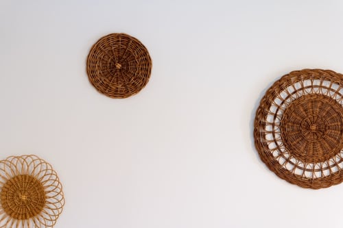 Woven wicker wall decorations at Mas Bella Cortis, a charming bed and breakfast in La Garde-Adhémar, France