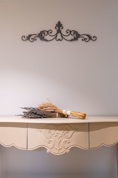 Ornate mantelpiece at Mas Bella Cortis with dried lavender and wheat bundles, La Garde-Adhémar