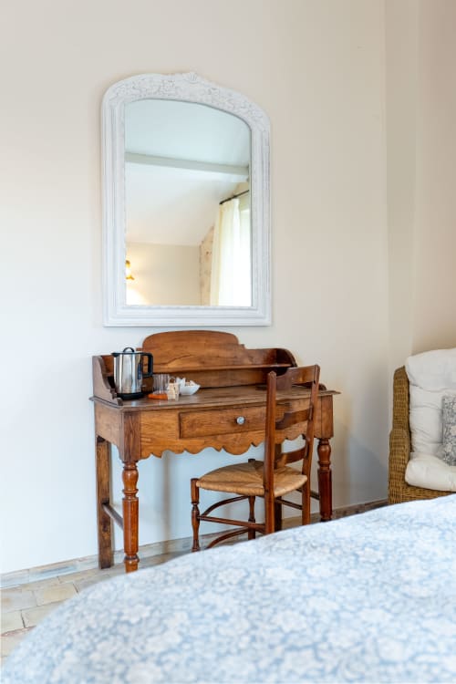 Wooden vanity with mirror at Mas Bella Cortis B&B in La Garde-Adhémar, France