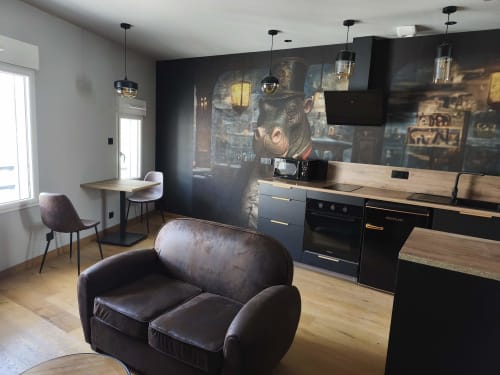 Cuisine-salon Hippo Loft à l'hôtel Escale à Clisson avec mobilier design, meubles noirs modernes et plans de travail en bois