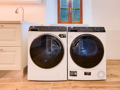 Modern washer and dryer in Serena apartment at Tuscan Sun Stays, Lajatico Italy laundry room