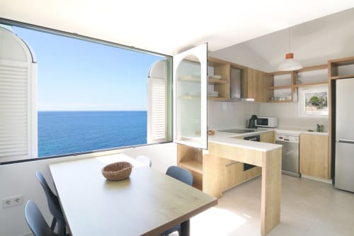 Modern kitchen and dining area with sea view at Xanadú apartment, Riurau Home, Calpe