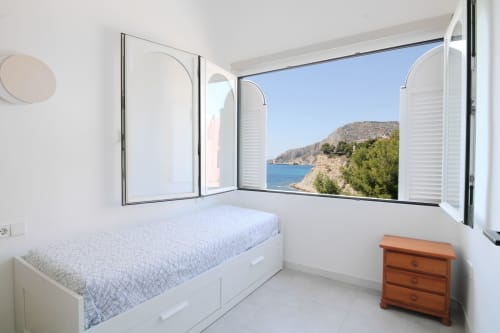 Bright bedroom with sea view balcony in Xanadú apartment at Riurau Home, Calpe, overlooking Mediterranean coast