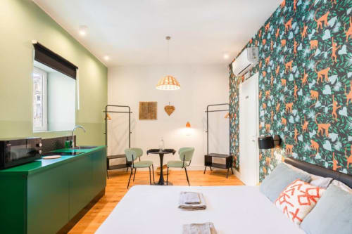 Suite Maradona Naples Superior Double Room with green kitchen, tropical wallpaper, dining area, and modern amenities