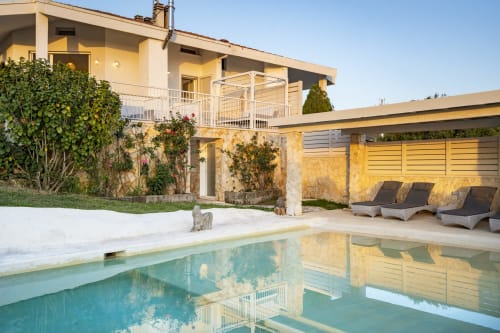 Top Villas Sardinia pool and luxury villa in Quartu Sant'Elena with lounge chairs and terrace
