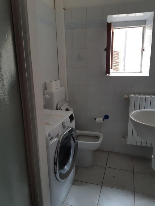 Bagno con lavatrice e wc presso Sogni D'Oro Guest House, Santa Maria Novella, Firenze