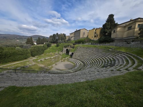 Ancient Roman amphitheater ruins with Renaissance buildings at Sogni D'Oro Guest House, Florence