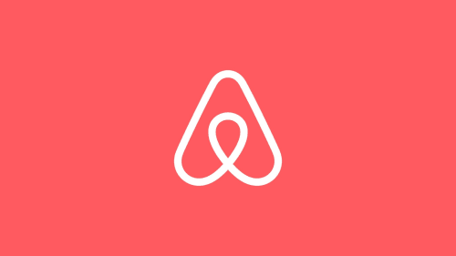 Logo Airbnb sur fond corail pour le gestionnaire immobilier Le 9 Victor Hugo à Aix-les-Bains