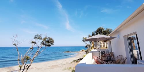 Marina di Bravone beachfront apartment in Linguizzetta with sea view terrace and private beach access