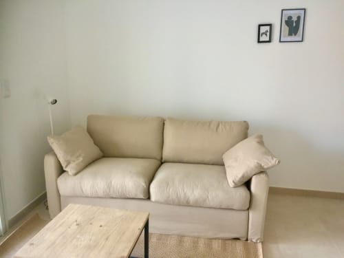 Beige sofa with cushions in Marina di Bravone apartment, Linguizzetta