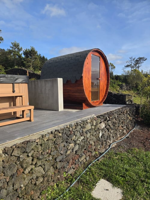 Modern barrel-shaped villa Casa da Ioio at Adega da Quinta in Madalena with wooden door and stone terrace