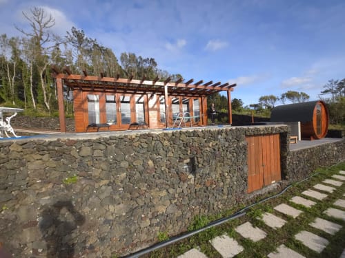 Casa da Ioio villa at Adega da Quinta in Madalena with modern terrace, stone walls, and private pool area