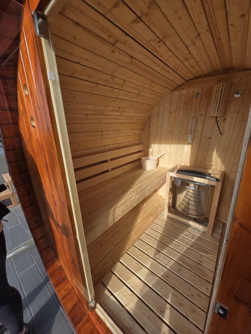 Interior of wooden sauna at Casa da Ioio villa, Adega da Quinta hotel, Madalena Portugal with bench seating